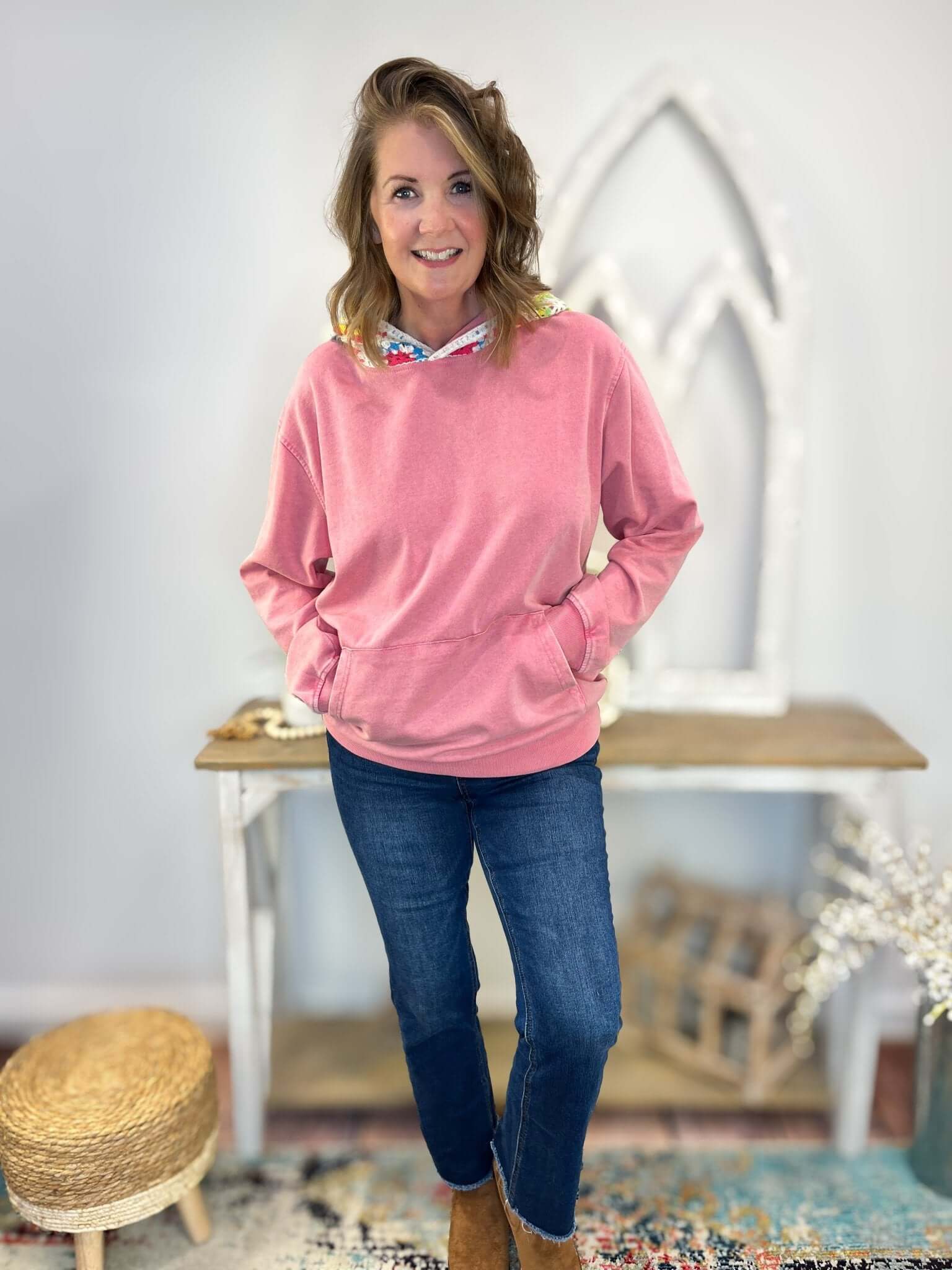 Woman wearing a Crochet Vintage Wash Pullover Hoodie with crochet detailing and a mineral wash effect.