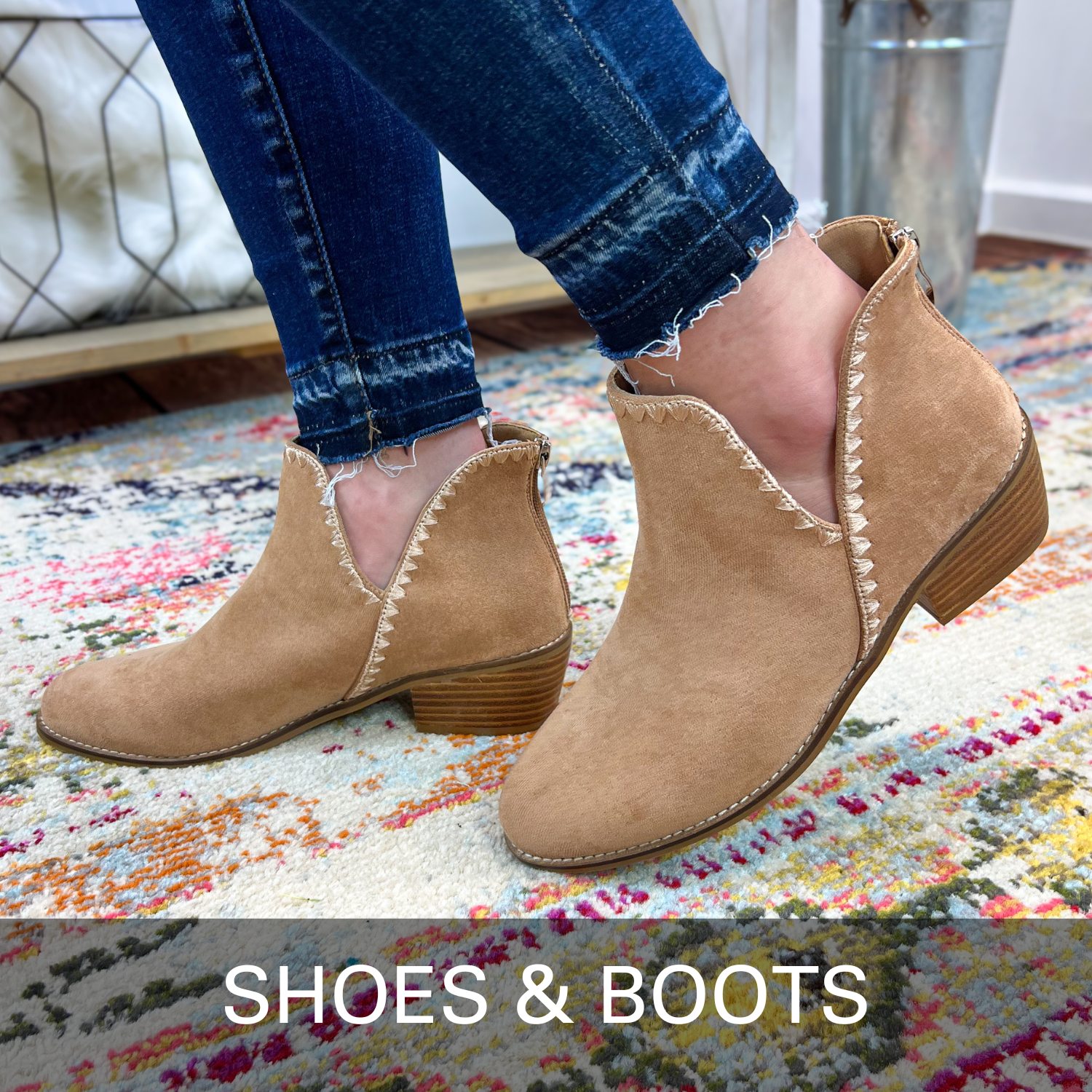 Tan ankle boots worn with blue jeans on a colorful rug, labeled 'SHOES & BOOTS'.