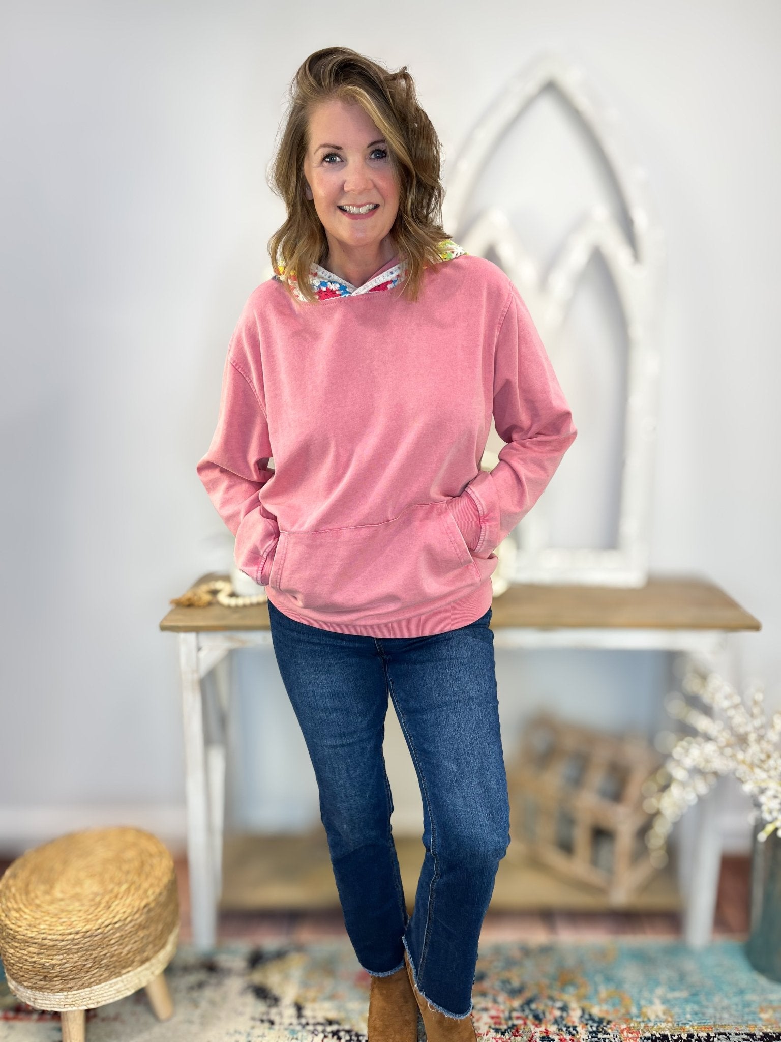 Woman wearing a Crochet Vintage Wash Pullover Hoodie with crochet detailing and a mineral wash effect.