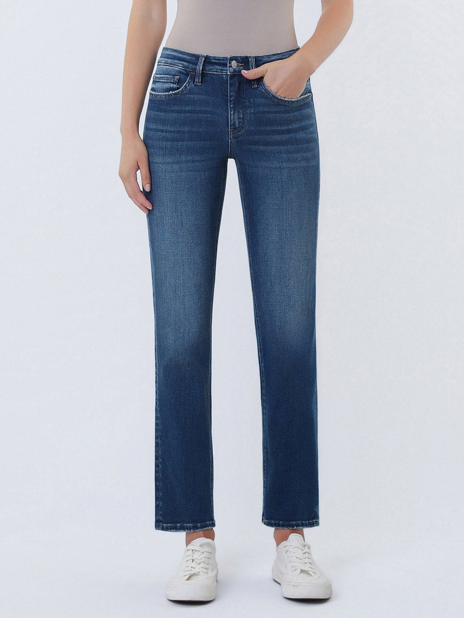 Person wearing blue jeans on a white background