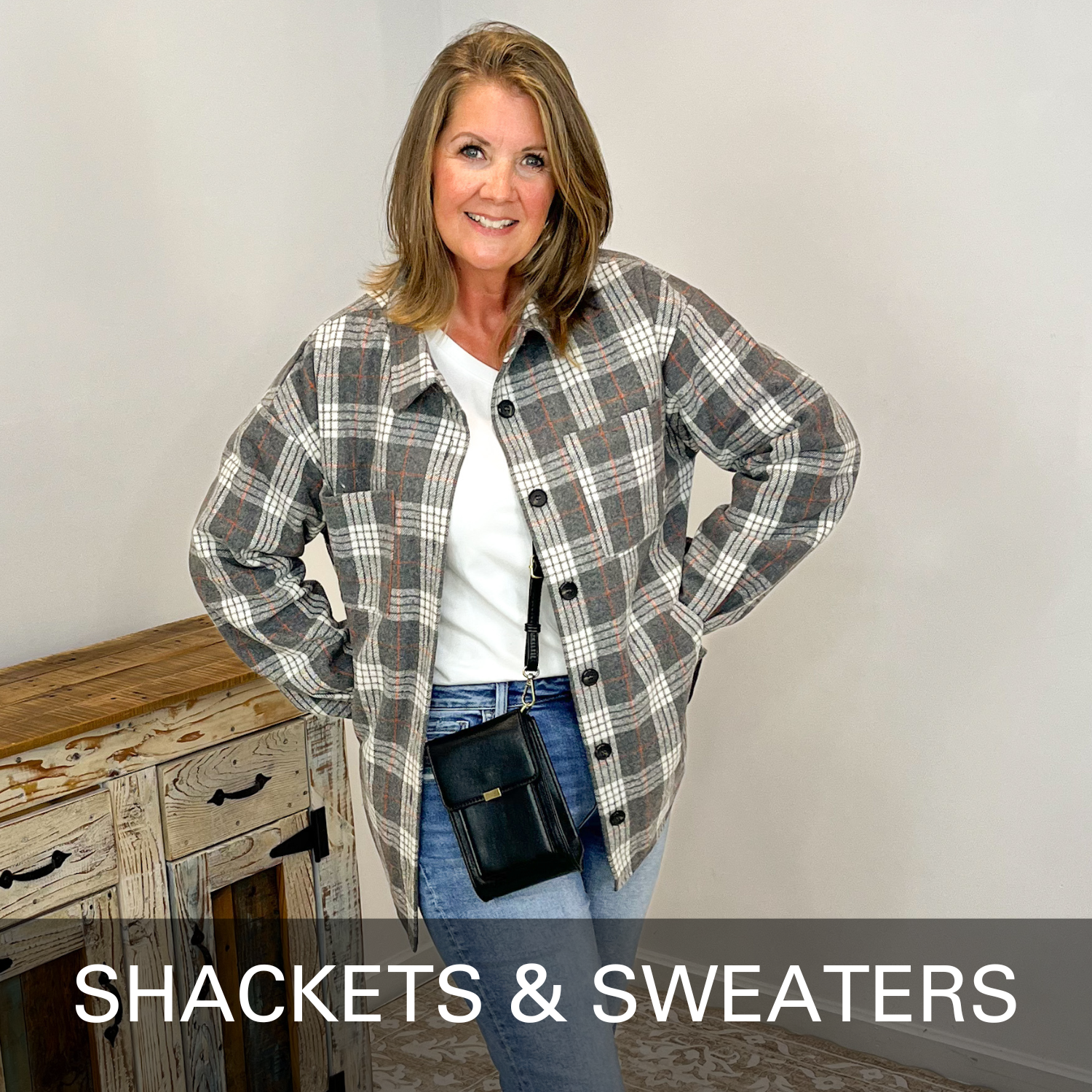 Woman wearing a plaid shacket with text 'SHACKETS & SWEATERS' on a plain background